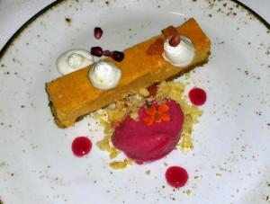 “Forty-Second Street” butternut squash cheesecake with cranberry sorbet, vanilla Chantilly and pomegranate seeds